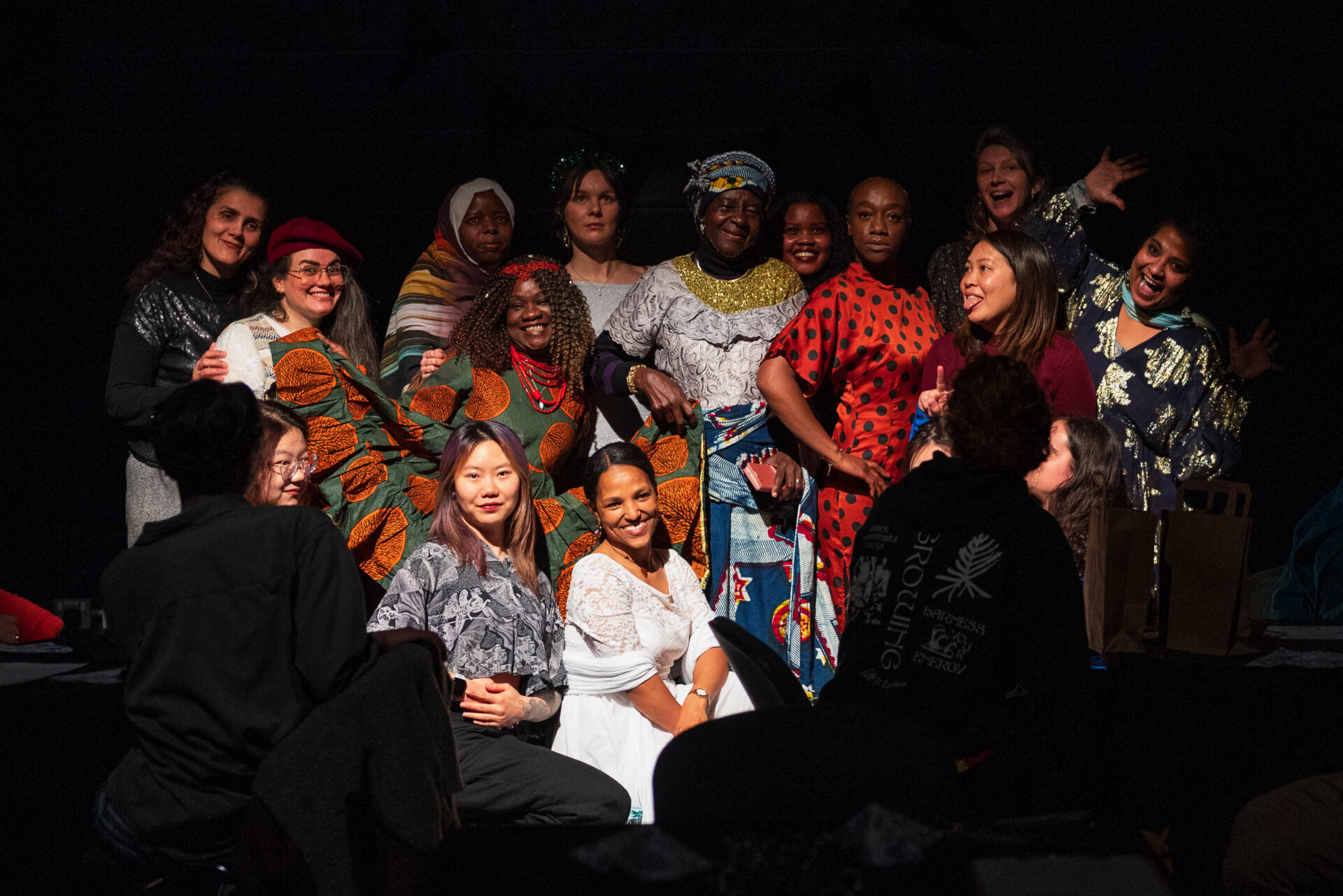 group of people in a performance posing for a photo