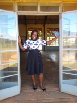 Brenda Mawerere in the doorway of Walukuba Community Centre