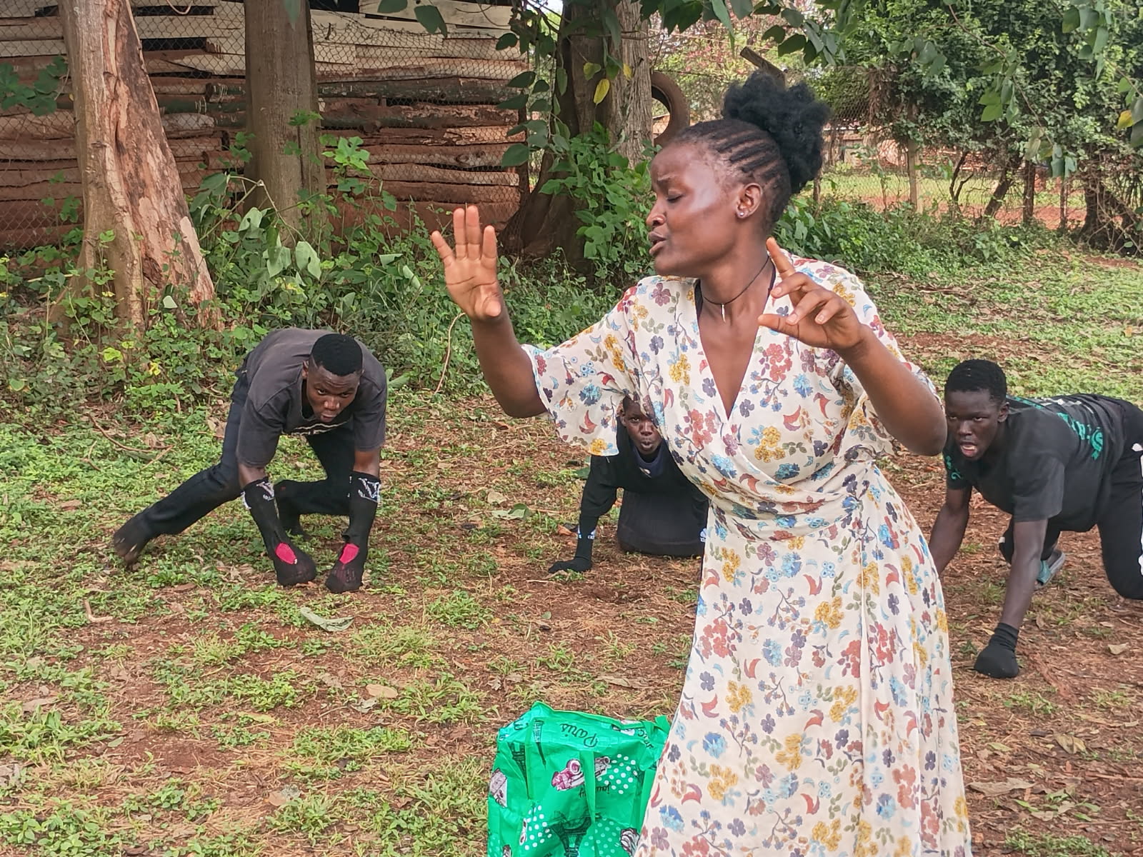 Scene from performance of Chantal and the Evil Senga. Chantal in the foreground with 3 gorilla guards behind her 